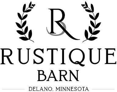 Logo with R in laurel branches, text: Rustique Barn—Minnesota's charming barn wedding venue.